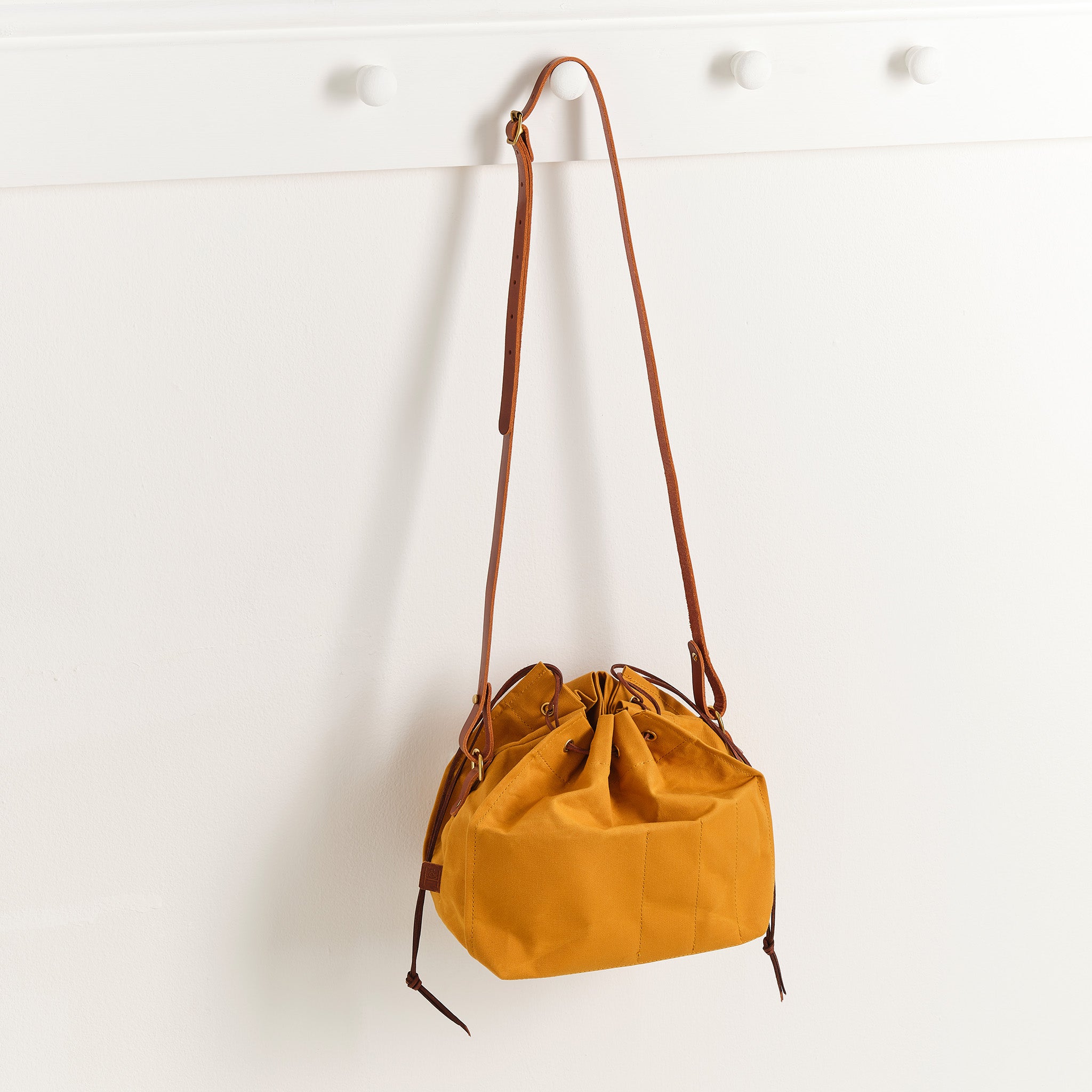 Hide and Hammer Deco bag Honey hanging